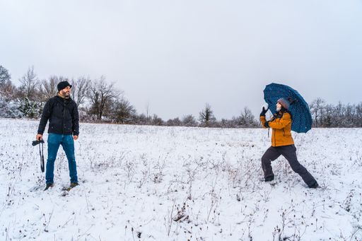 A couple playing with snowballs at a park during winter in the town of Opakua near Vitoria in Araba, Basque Country. Spain