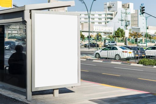 A blank poster space on a bus stop with space for text - perfect for advertisement backgrounds
