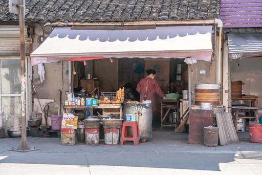 A variety of goods and products for sale in an outdoor street marketplace