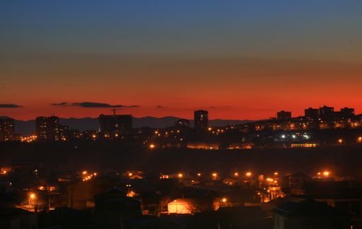 Beautiful city lights with amazing sunset in background