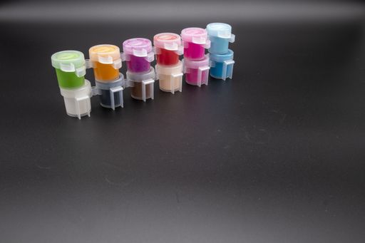 Paint pots containing acrylic paint ideal for hobby craft