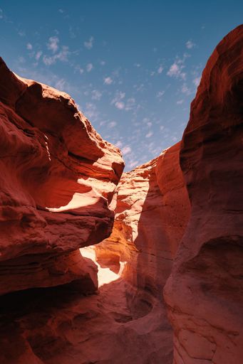 A vertical shot of a beautiful red canyon found in the wild on a sunny day