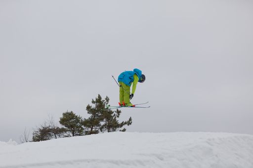 A skier making a high jump in the air