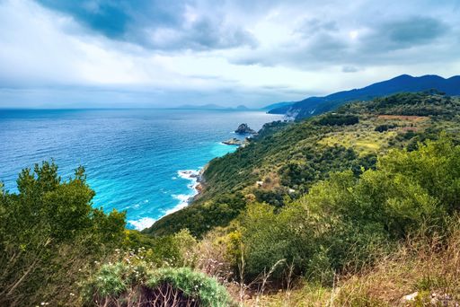 A high angle shot of the wild north side of Skopelos island on a cloudy day
