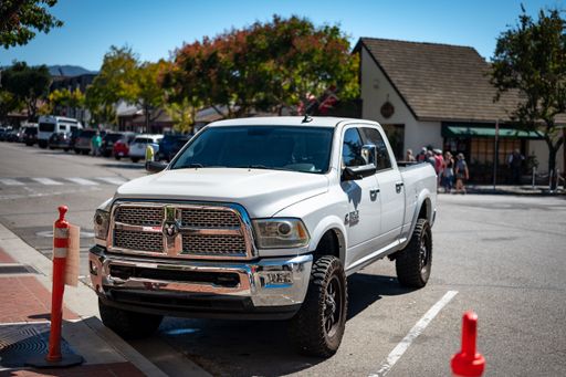 Detail of a white typical American Dodge RAM 2500 pickup truck