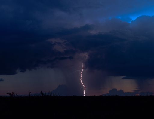 A solitary lightening bolt at night