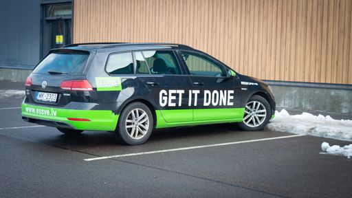 Riga, Latvia, February 15, 2022: Business car parked at store with slogan saying - get it done