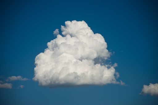 A closeup shot of white fluffy clouds on a blue sky - perfect for wallpaper