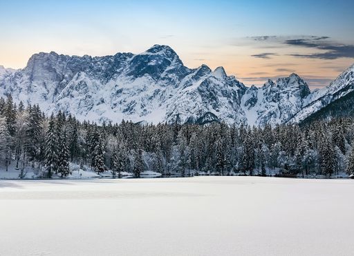 A beautiful view of the Laghi di Fusine lakes near Tarvisio in Italy on a white winter day