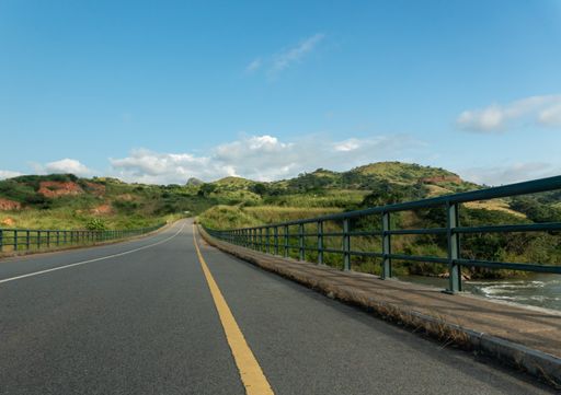 A road-bridge over the Keve river surrounded by hills and greenery in Angola