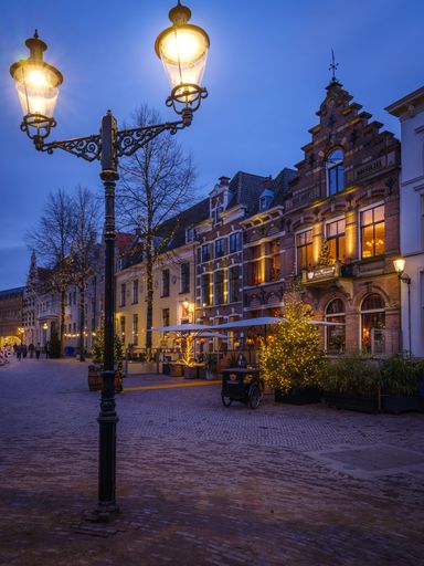 A vertical shot of the Huis Vermeer Hotel in Deventer, the Netherlands in the evening