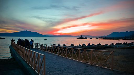 A landscape of a group of people near Lake Chapala during the sunset in Mexico