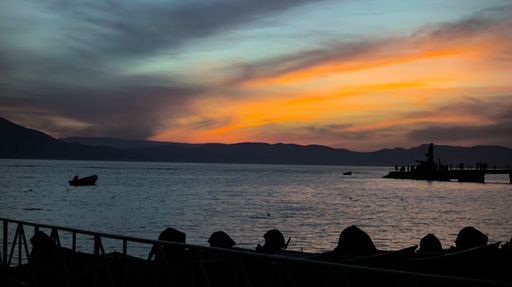 A landscape of a group of people near Lake Chapala during the sunset in Mexico
