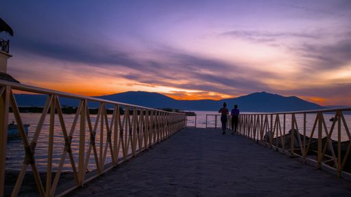A landscape of a pier over Lake Chapala during the sunset in Mexico