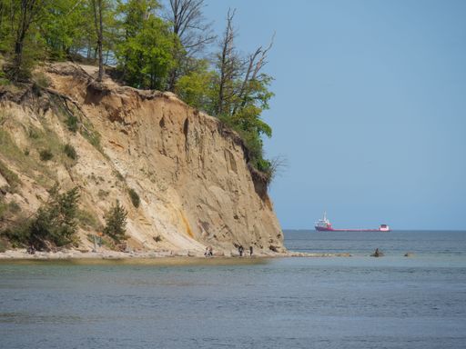 The view of Baltic sea with a large cargo ship in the distance.