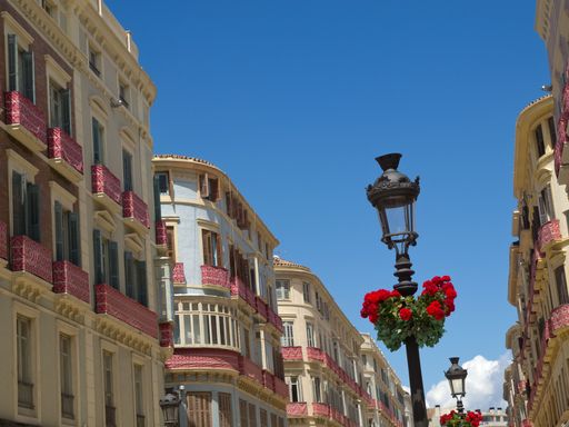 A low angle of old-fashioned architectural buildings in Malaga, Spain