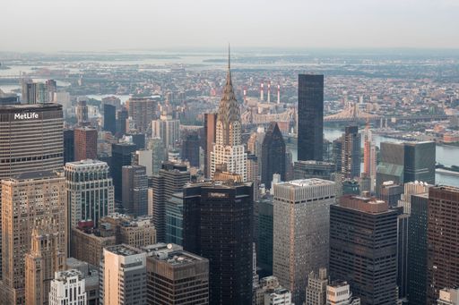 A horizontal shot of many skyscrapers next to each other in Manhattan Island New York in daylight