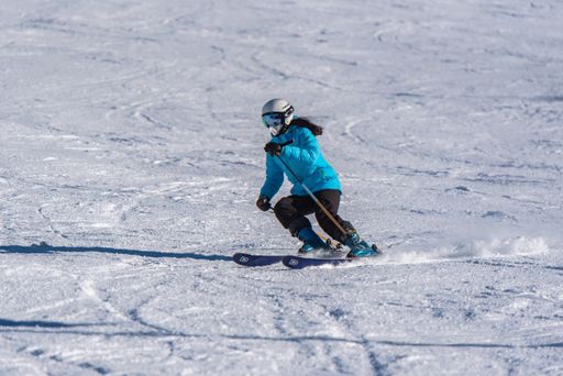 Pas de la Casa, Andorra: January 3, 2021: Young woman skiing in the Pyrenees at the Grandvalira ski resort in Andorra in Covid19 time