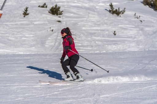 Pas de la Casa, Andorra: January 3, 2021: Young woman skiing in the Pyrenees at the Grandvalira ski resort in Andorra in Covid19 time