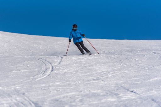 Pas de la Casa, Andorra: January 3, 2021: Young woman skiing in the Pyrenees at the Grandvalira ski resort in Andorra in Covid19 time