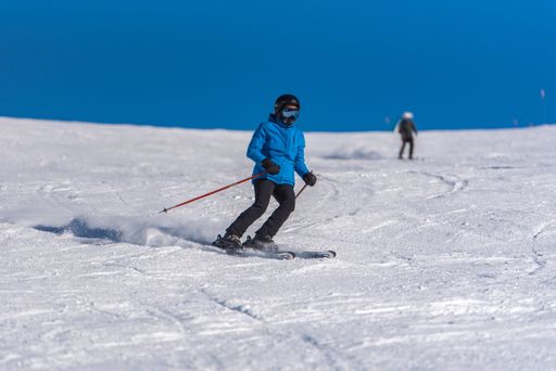 Pas de la Casa, Andorra: January 3, 2021: Young woman skiing in the Pyrenees at the Grandvalira ski resort in Andorra in Covid19 time