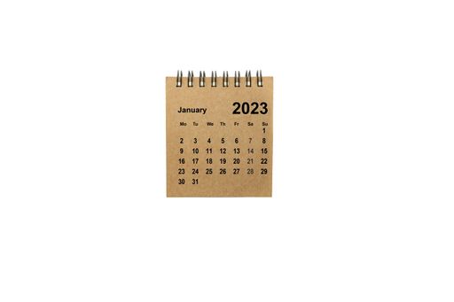 A brown paper January 2023 calendar on a white background