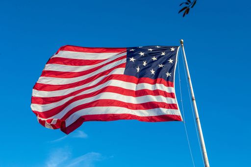 A low angle closeup shot of the flag of the United States of America on a sunny day