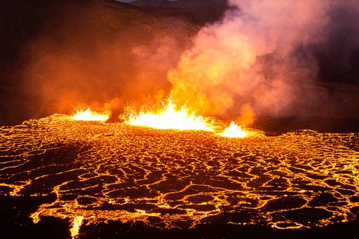 An aerial view of the volcano eruption at night
