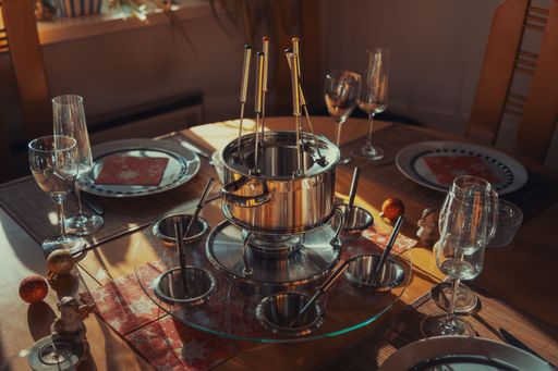 eating traditional fondue with family at home
