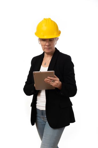An engineer woman looking at the tablet on white background