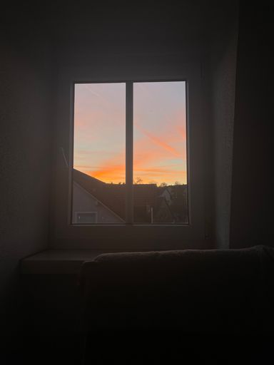 A beautiful view of sunset through a window