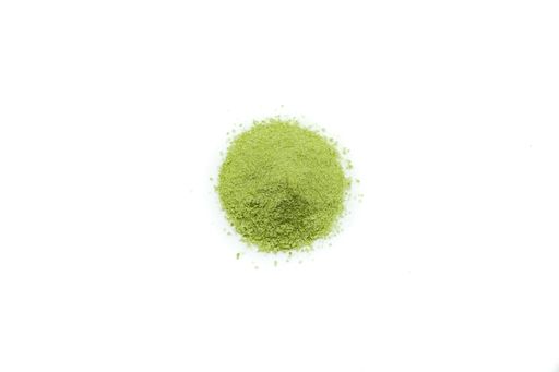 Cenital view of heap green matcha powders isolated on white background.