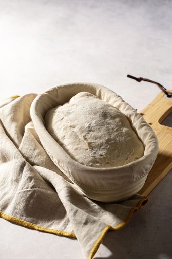 A high angle shot of sourdough in a banneton basket