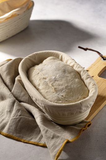 A high angle shot of sourdough in a banneton basket