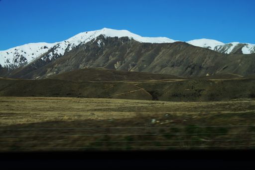 A beautiful shot of the top of a mountainous landscape covered with snow