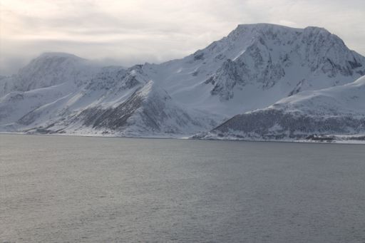 A beautiful view of the lake near the mountains on a sunny day
