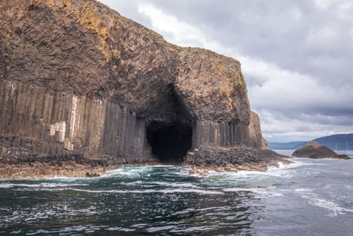 The cloudy sky over Fingal's Cave, Isle of Staffa, Scottish Highlands in summer