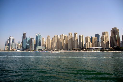 A stunning aerial view of a picturesque cityscape situated along the coastline