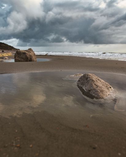 A beautiful shot of the scenic rocky White Cliff Bay of the Isle of Wight on a gloomy day