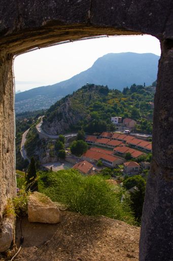 A view from Klis fortress on houses and roads of Klis and Kozjak mountain in the distance, Croatia
