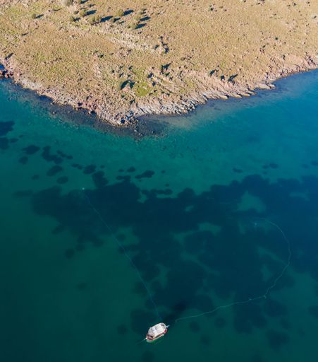 A vertical aerial view of fishing nets deployed near the shore in Kalloni,Lesvos,Greece