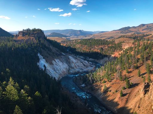 A scenic view of the Calcite Springs in Yellowstone National Park on a sunny day in Wyoming, USA