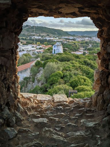 The townscape of Obidos seen from an old stone window