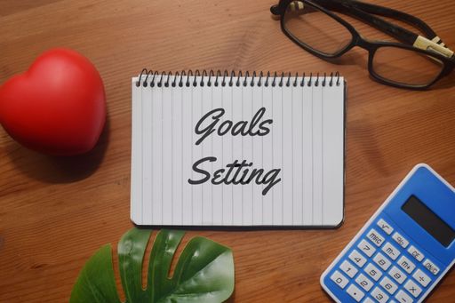A top view of a Goal Setting wording on a paper. Business and education concept