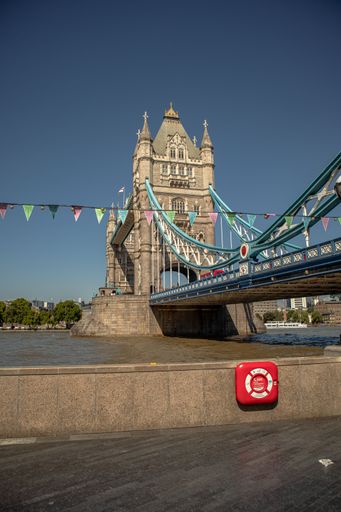 A vertical shot of the decorated Tower bridge on a sunny day