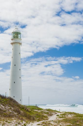 A vertical shot of a lighthouse on a cloudy day in Cape Town, South Africa
