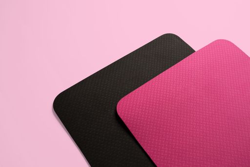 A closeup shot of two fitness mats isolated on a p background