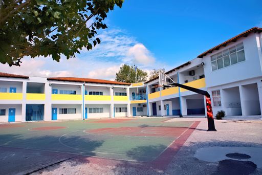 A landscape of basketball court on Greek high school building