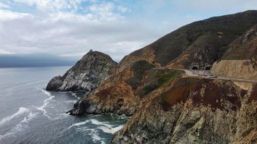 A drone shot of the rocks on Gray Whale Cove State Beach in California