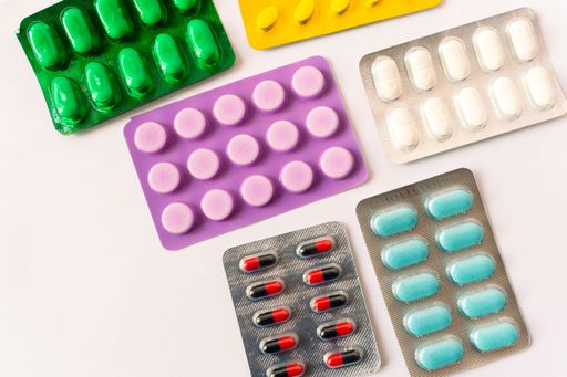 Various medical equipment, thermometer, ampoules, pipette, drugs, tablets, capsules, spray, patch, syringe, vials on a white background. Medicine,